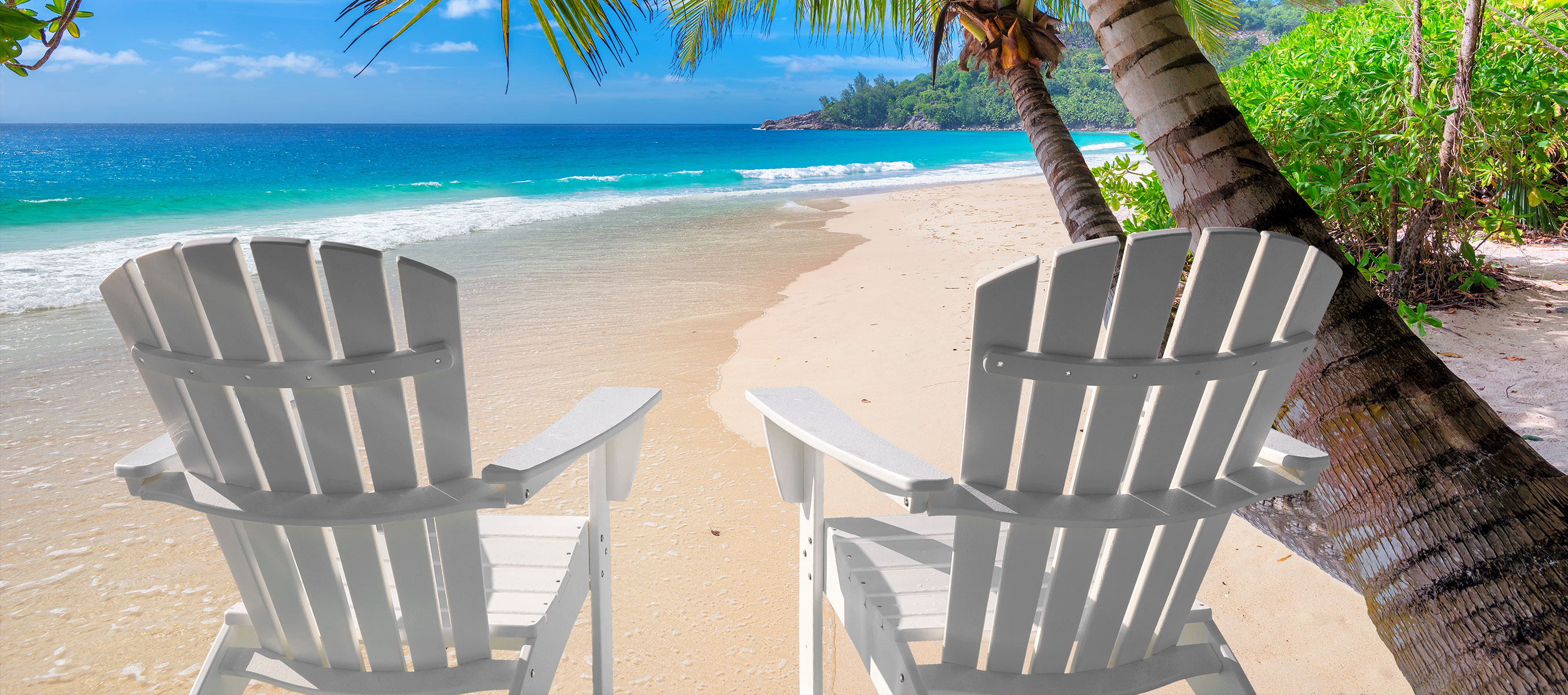 Adirondack chairs on a beach