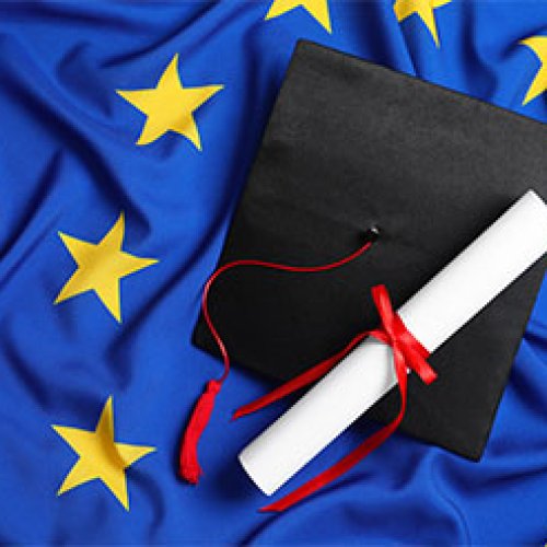 EU flag with mortarboard and diploma