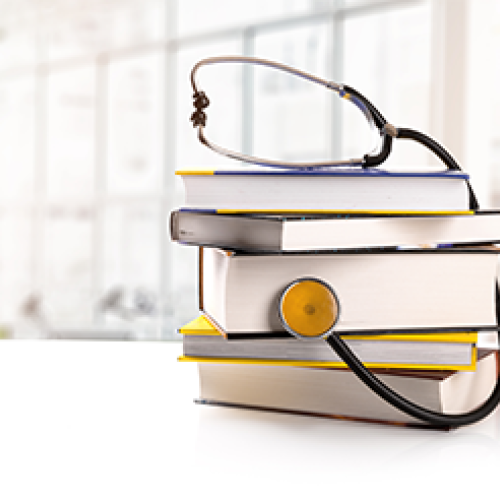 Stethoscope on book pile